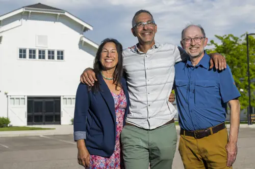 Portrait of commissioners Slotnick, Vero and Strohmaier with the Fairgrounds in the background