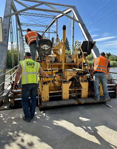 Public Works crews resurfacing the Maclay Bridge in summer 2024